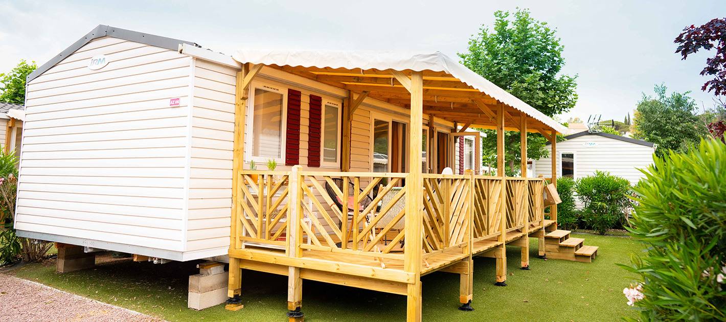 A holiday home and decking at Le Montourey holiday park on the Cote d'Azur